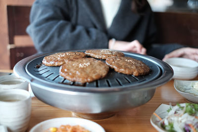 Close-up of man having food in plate