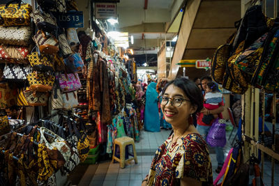 Women standing at market stall