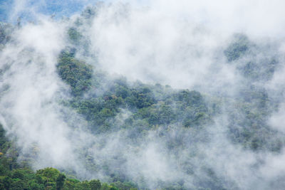 Scenic view of waterfall against sky