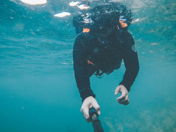 Woman swimming in undersea