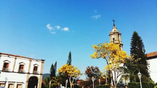 Low angle view of church against blue sky