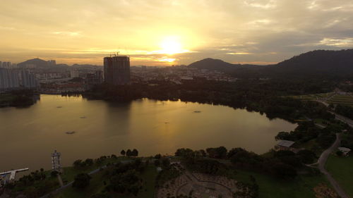 Scenic view of cityscape against sky during sunset