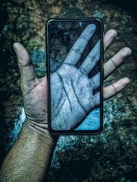 Close-up of man using mobile phone