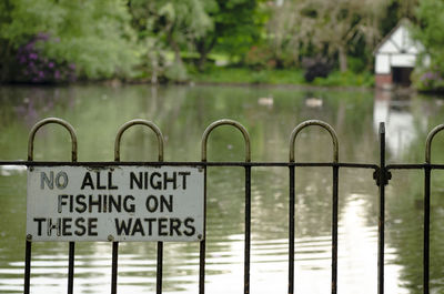 Information sign on metal fence