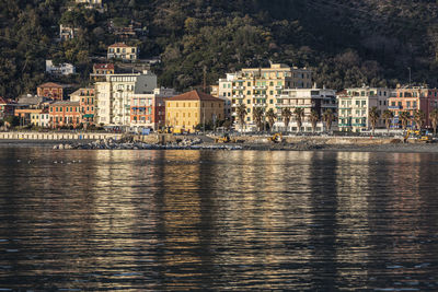 River by buildings in city