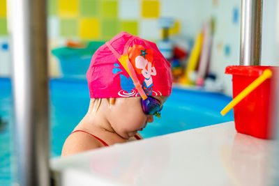 Cute girl at swimming pool