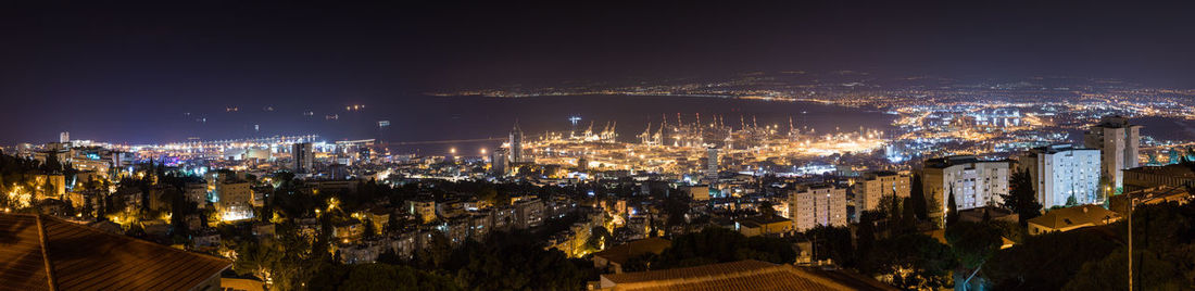 High angle view of illuminated city buildings at night