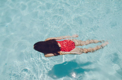 High angle view of woman swimming in pool