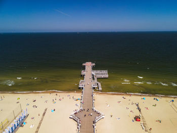 High angle view of cross on the beach against the sky an aerial view of the pier in gdansk, poland. 