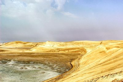 Scenic view of desert against sky