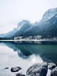 Scenic view of lake and mountains against sky