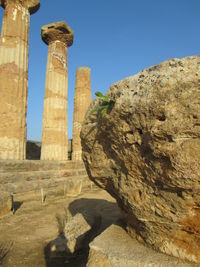 Low angle view of old ruins against sky