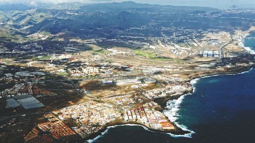 Aerial view of cityscape against sky