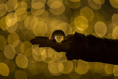 Midsection of person holding umbrella