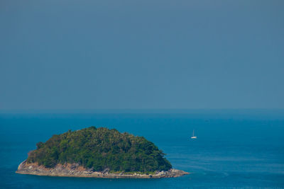 Scenic view of sea against clear blue sky