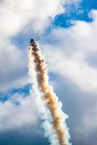 Low angle view of vapor trail against sky