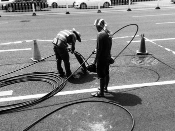 Men standing on sidewalk