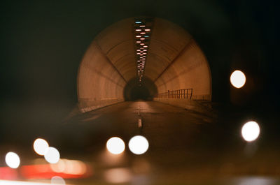 Low angle view of illuminated lights at night