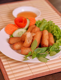 High angle view of fruits in plate on table