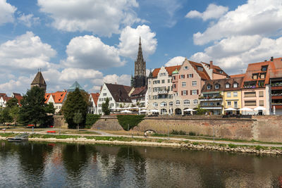 River amidst buildings against sky