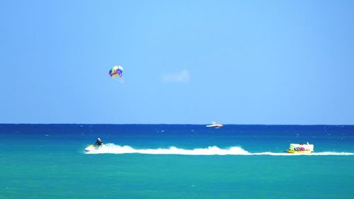 Scenic view of sea against blue sky