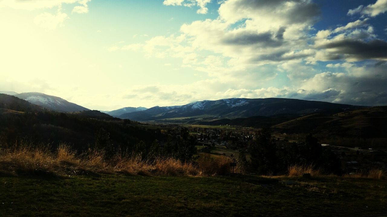 mountain, sky, landscape, tranquil scene, tranquility, mountain range, scenics, cloud - sky, beauty in nature, grass, nature, cloud, non-urban scene, cloudy, field, idyllic, remote, countryside, day, outdoors