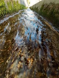 High angle view of water flowing in river