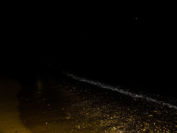 Close-up of illuminated water at night