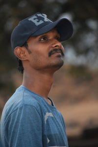 Portrait of young man looking away