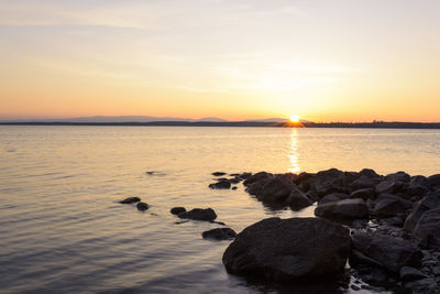 Scenic view of sea at sunset