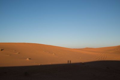 Scenic view of desert against clear sky