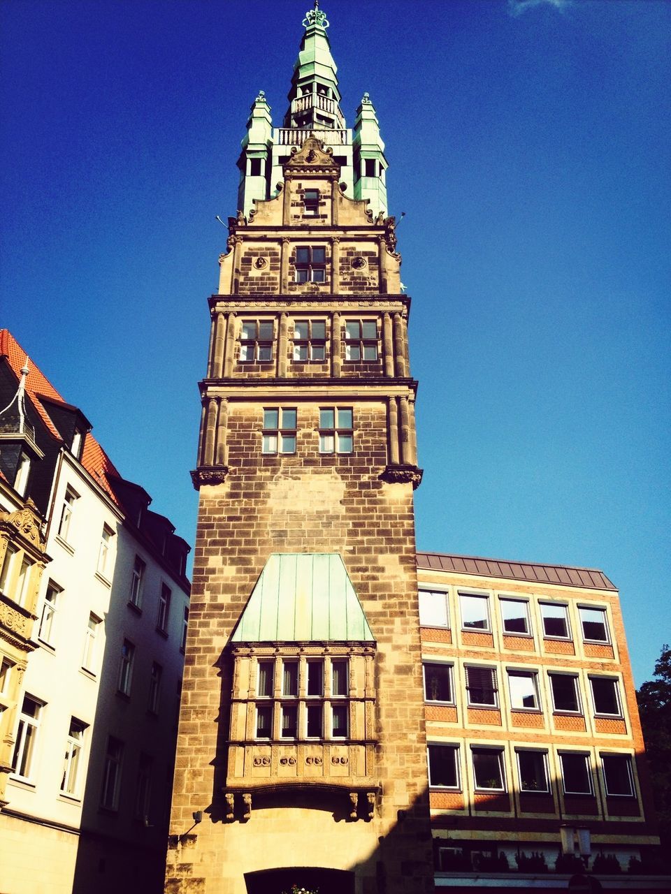 architecture, building exterior, built structure, low angle view, clear sky, blue, famous place, travel destinations, tower, tourism, city, history, capital cities, tall - high, travel, international landmark, clock tower, religion, church