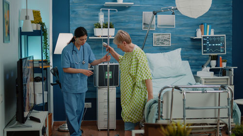 Doctor helping patient at hospital