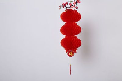 Close-up of decoration hanging against white background