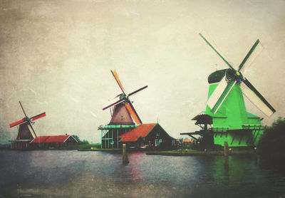 Traditional windmill on landscape