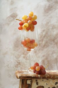 Close-up of grapes on glass table