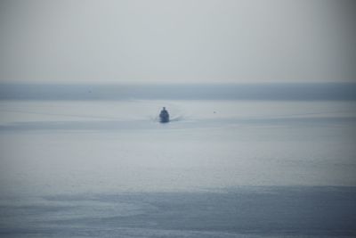 Scenic view of sea against sky during winter