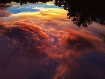 Scenic view of clouds in sky at sunset