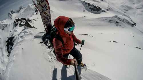 Full length of person on snowcapped mountain