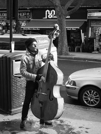 Full length of man playing at music concert