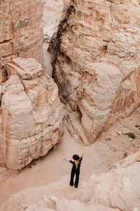 Woman standing on rock formation