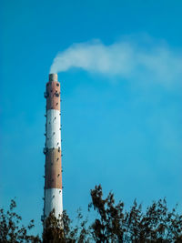 Factory chimney emits smoke, industrial smoke chimneys, 