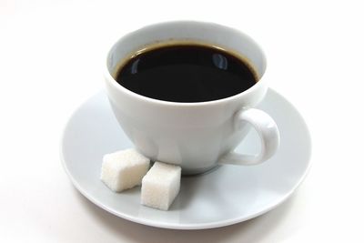 Close-up of coffee cup against white background