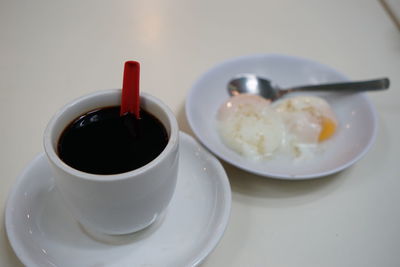 Close-up of coffee cup on table