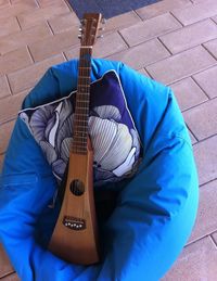 High angle view of man holding guitar