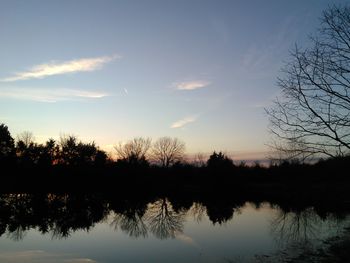 Scenic view of lake at sunset