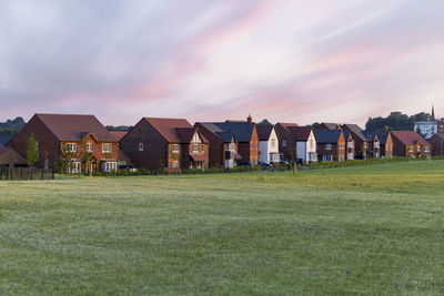 House on field against sky
