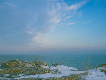 Scenic view of sea against blue sky