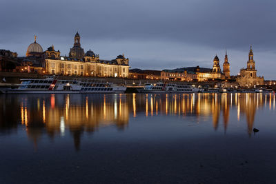 Reflection of illuminated buildings in city