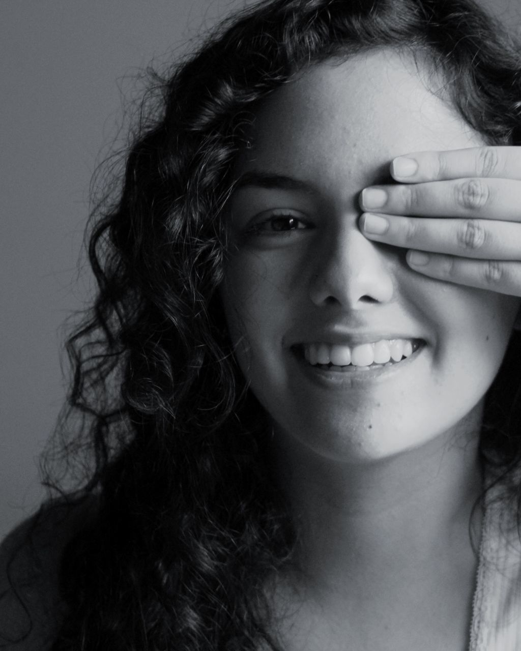 headshot, young adult, portrait, studio shot, one young woman only, looking at camera, gray background, young women, one person, close-up, one woman only, only women, beautiful woman, happiness, adults only, people, smiling, adult, indoors, human body part, day